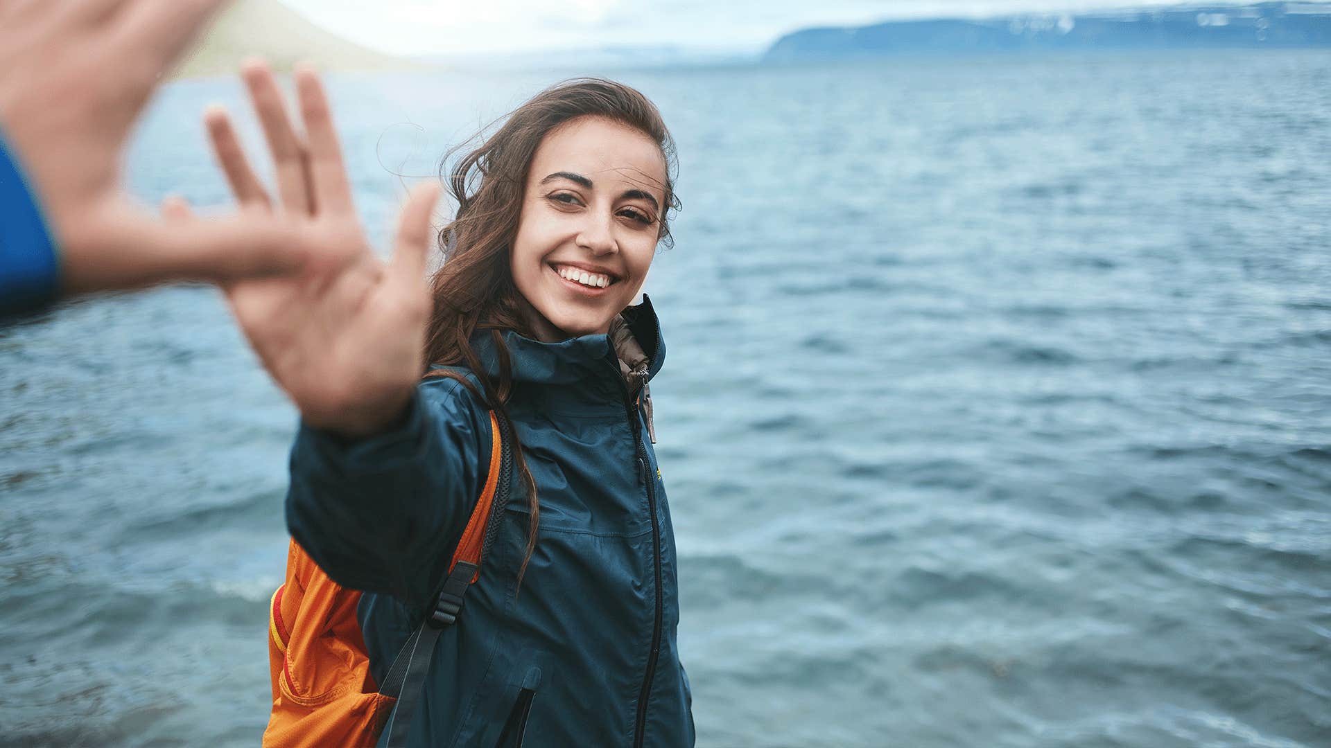 happy woman taking a selfie outdoors