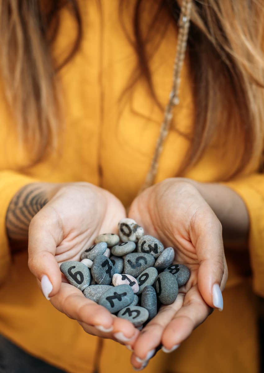 Numerology stones collected in her hands