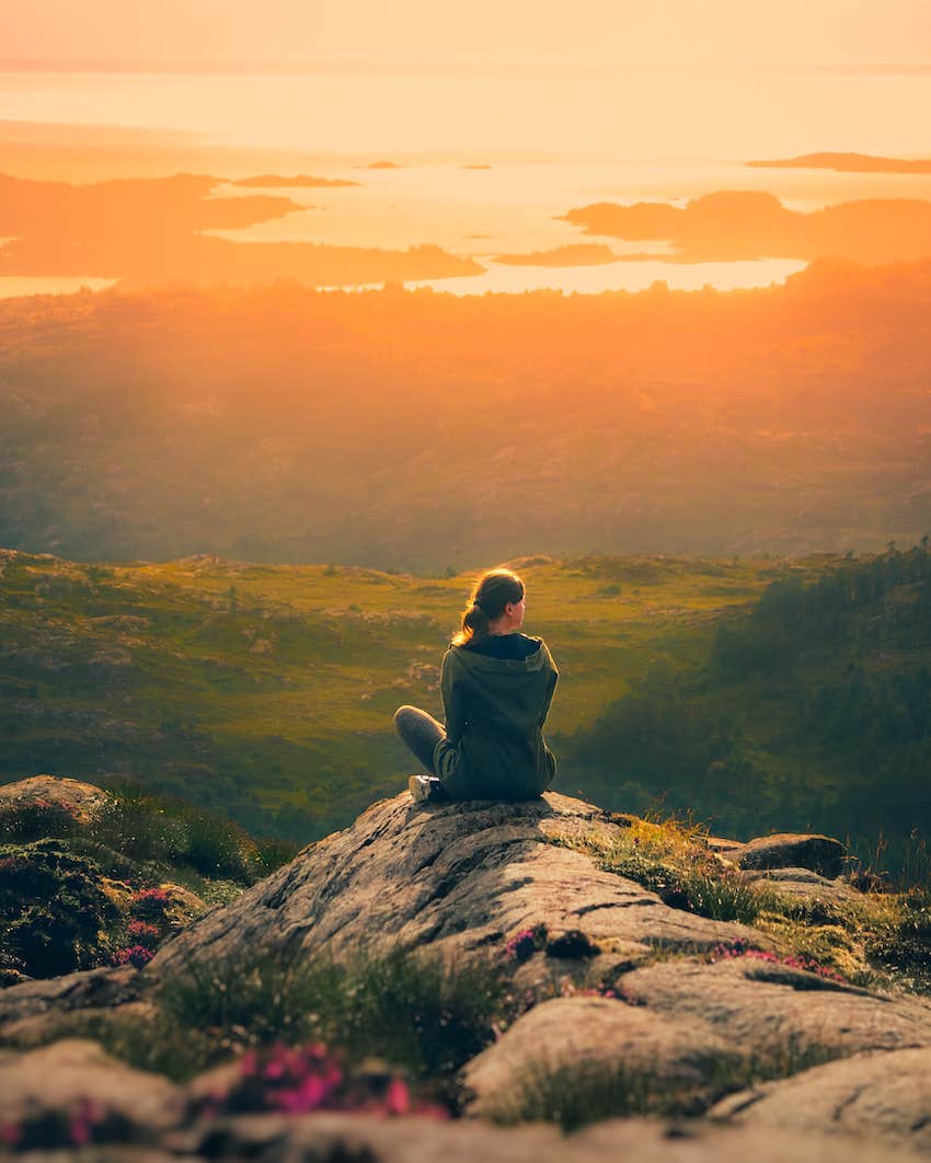Sitting on a mountain and thinking about settling in her relationship
