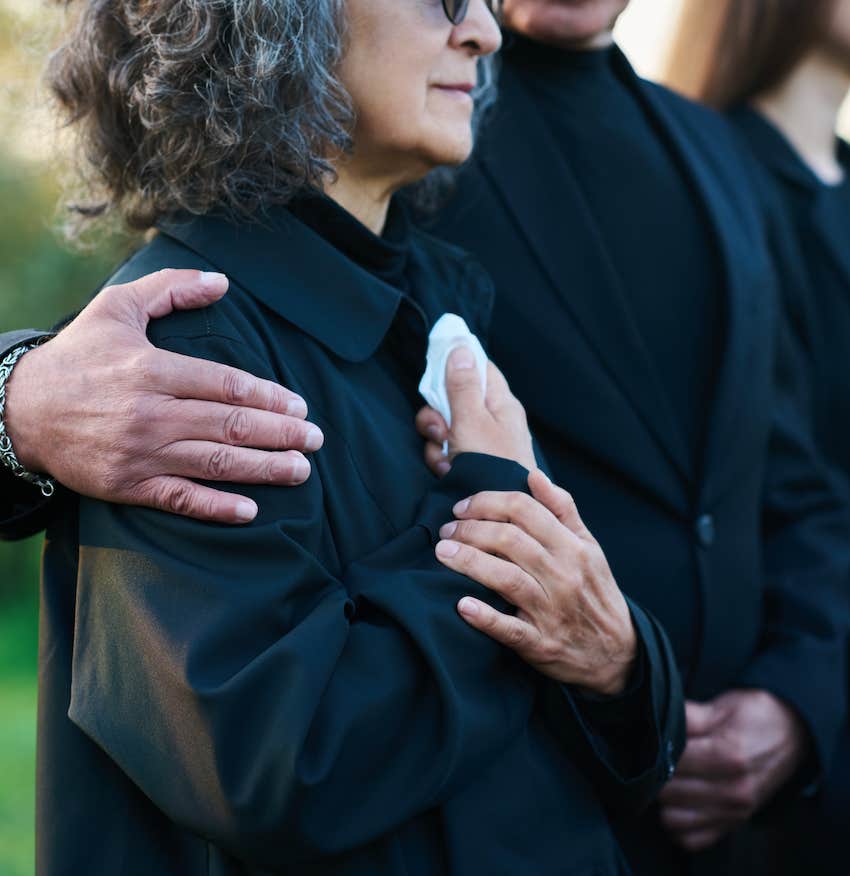 Grieving person comforted after death