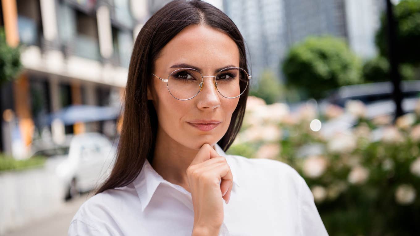 Subtle Signs Someone Is Faking Their Intelligence intelligent woman with hand on face