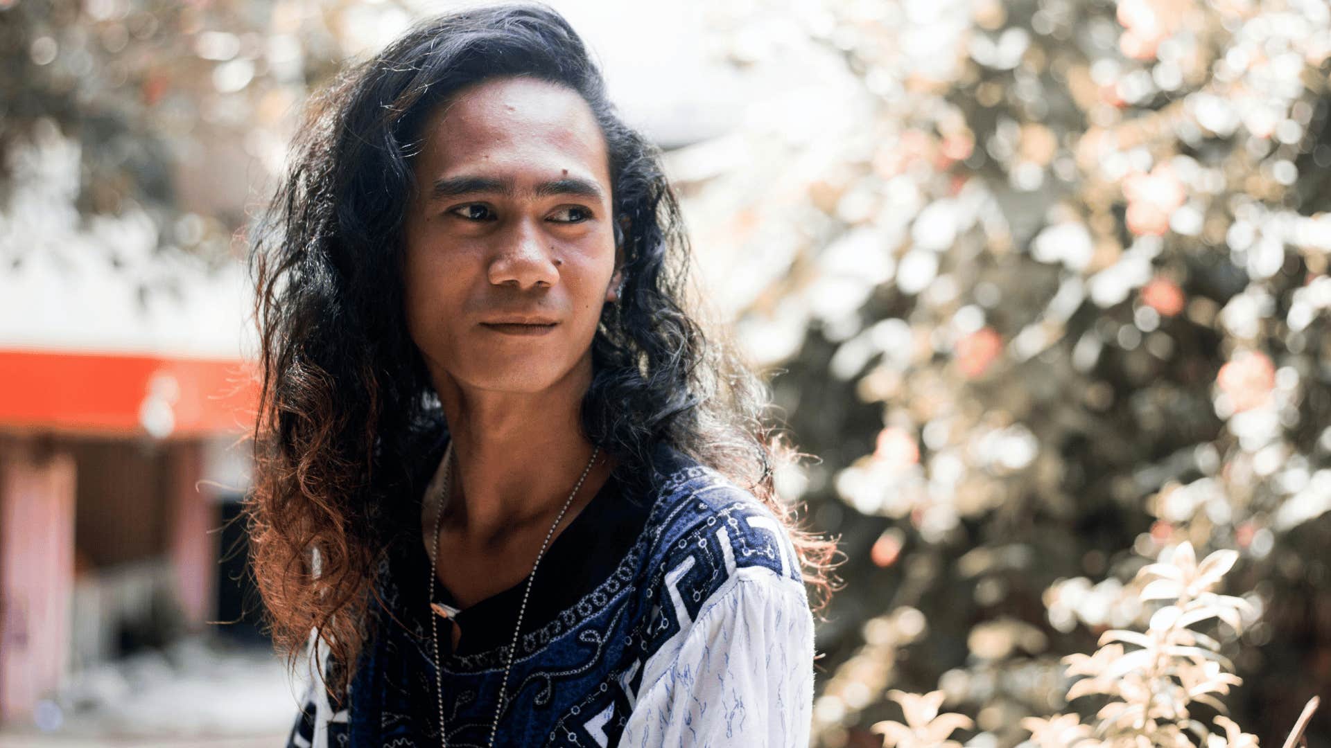 man with long hair thinking about his mistakes