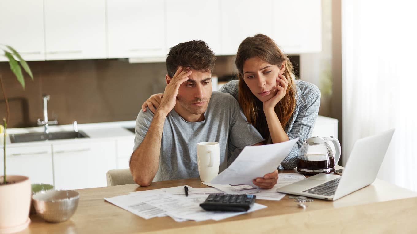 The Middle Class Has Been Divided Into 5 Categories — And The One You’re In Determines How Much Money You Need To Live Middle-class couple stressed about finances