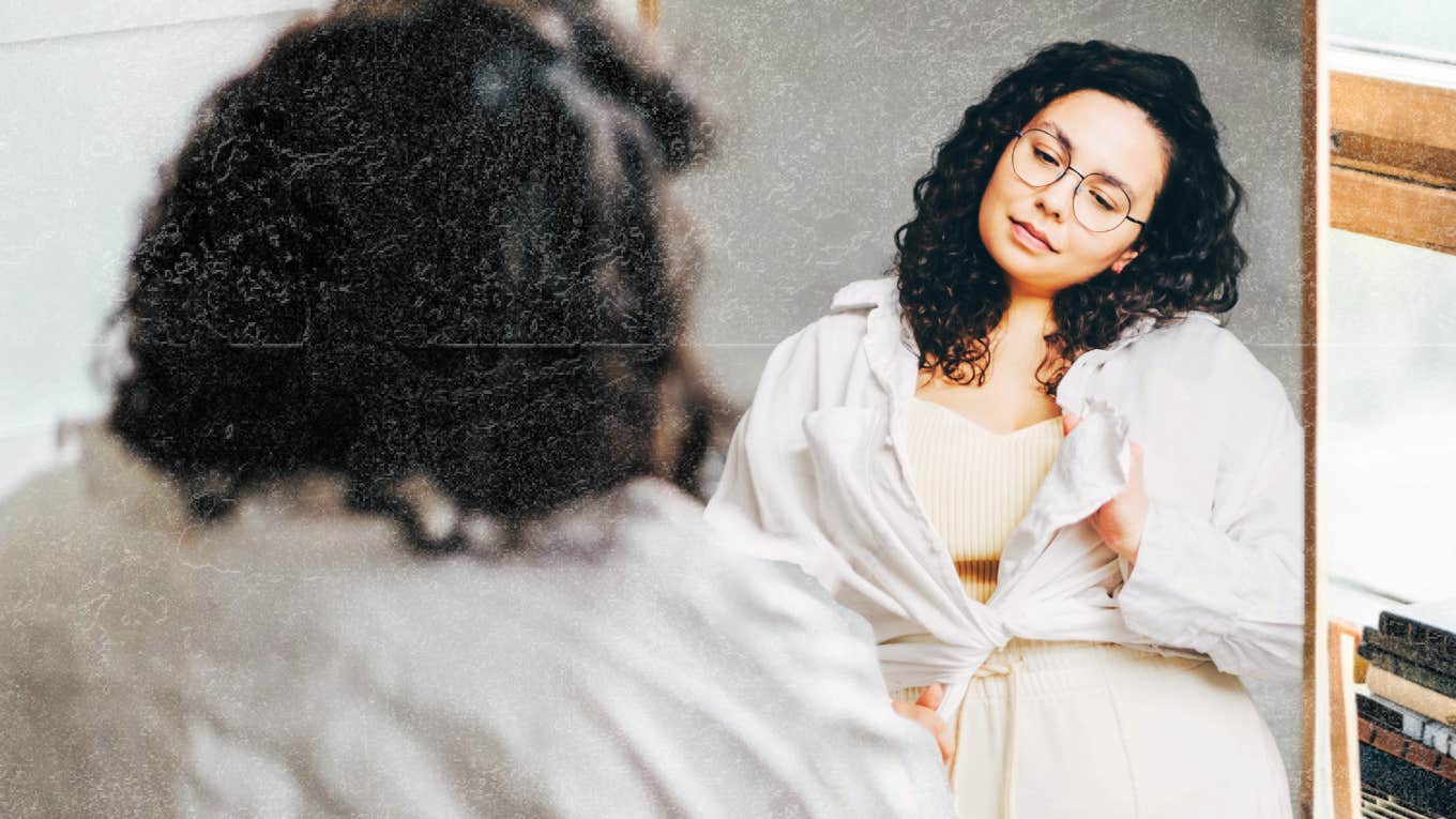 Things You Can Do Right Now To Feel Great For The Rest Of Your Day Woman looking at herself in mirror, feeling great