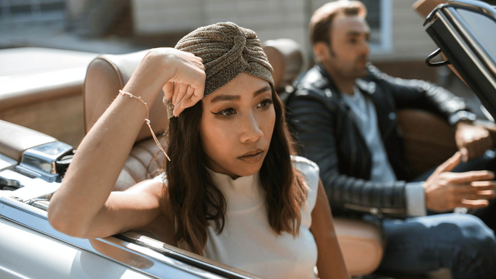 upset woman in a car