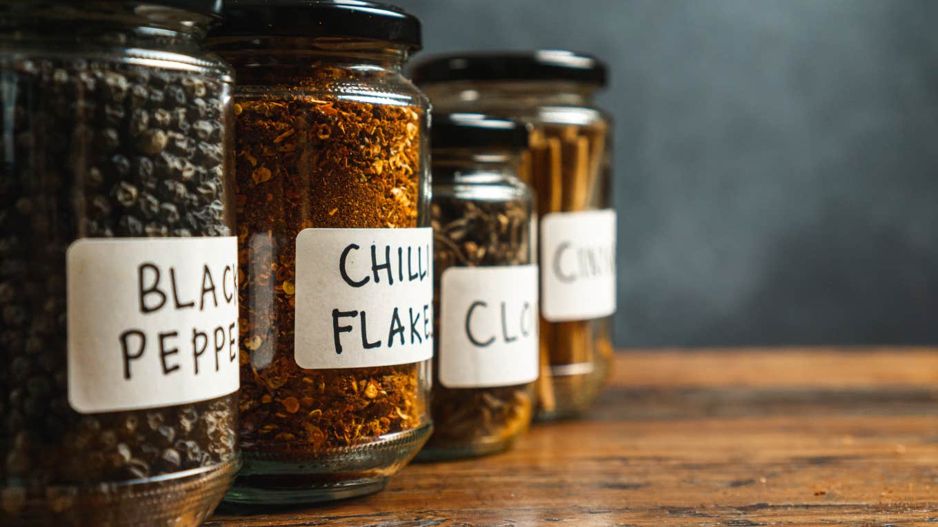 Wife Divorces Husband Who Tightens Their Jar Lids jars of spices lined up on kitchen shelf
