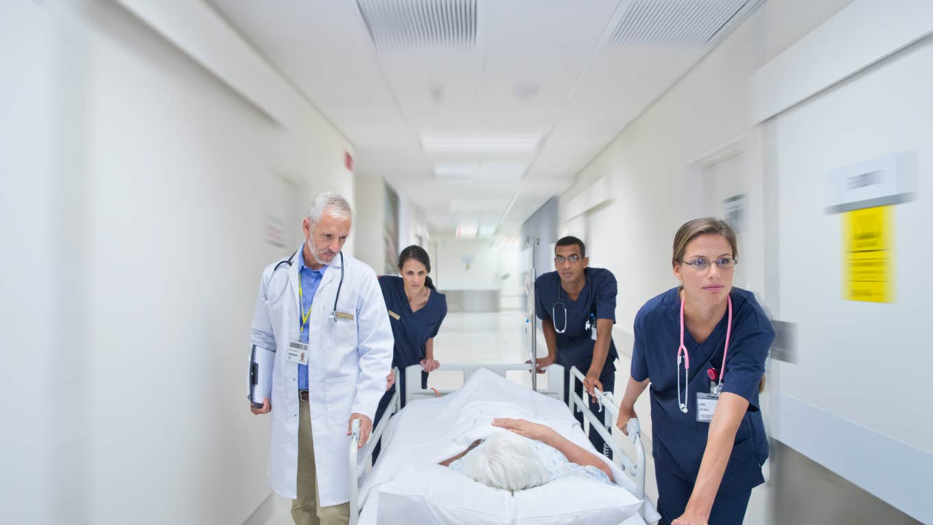 Wife Doesn't Know How To Move Forward With Her Husband After Traumatic Event person being wheeled down a hospital hallway in bed by medical team
