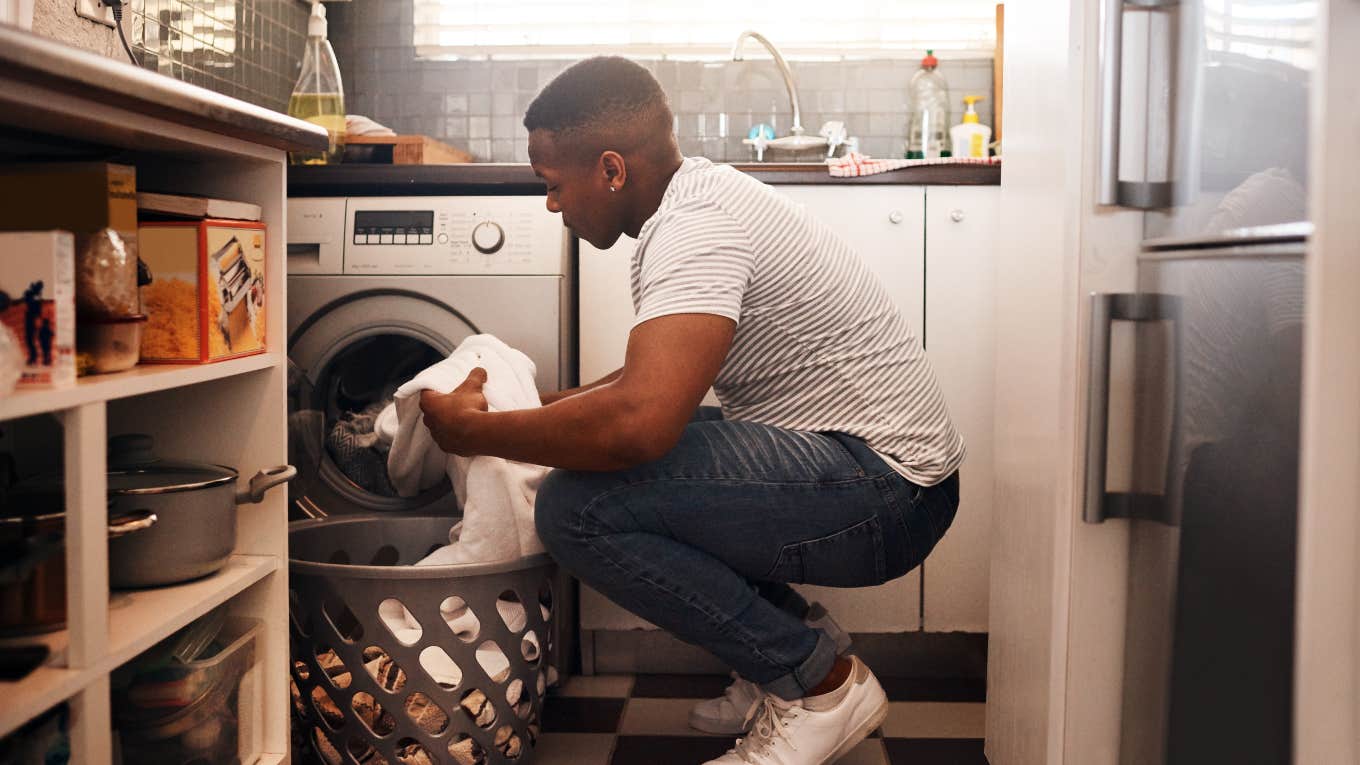 Wife Gives Husband Ultimatum Of Being Househusband Or Getting Divorce man putting laundry in washing machine