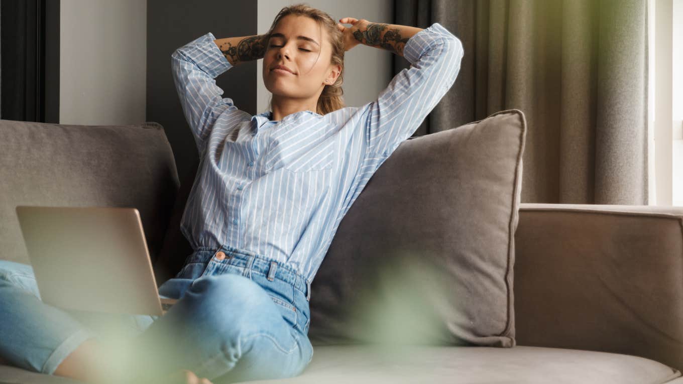 Woman Argues It's A ‘Trap’ To Work So Hard To Just Afford Living Alone Woman living alone relaxing in her house.