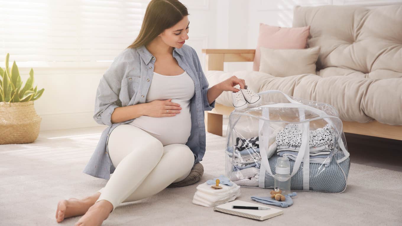 Woman Doesn't Want To Tell Her Family When She Has Her Baby pregnant woman packing for her hospital stay