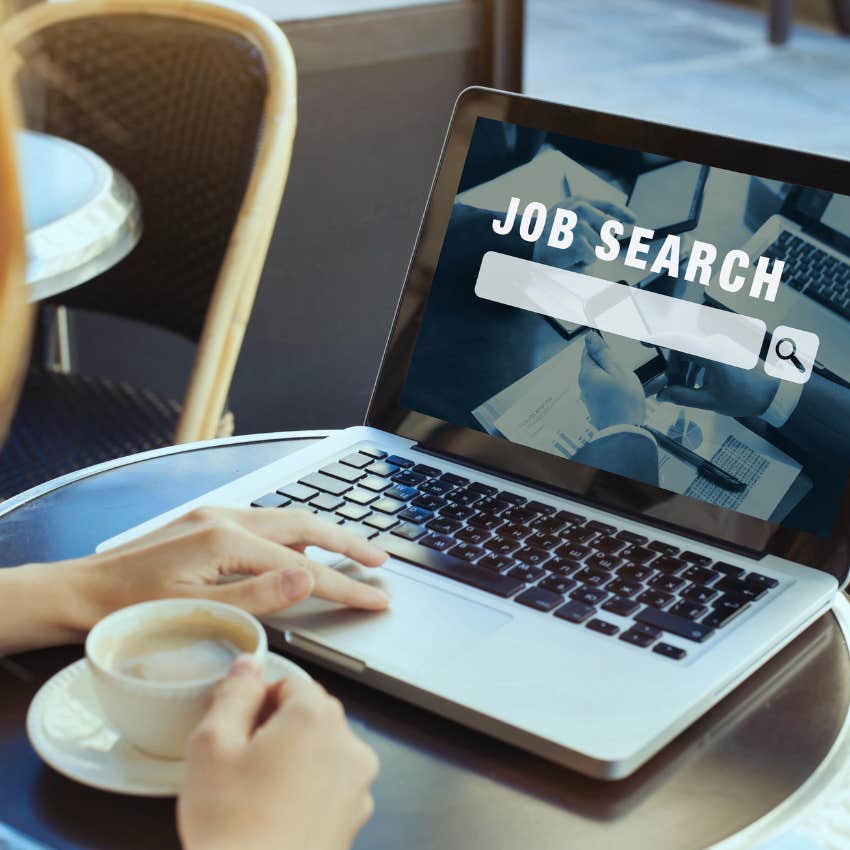 woman searching for job on a laptop while drinking coffee
