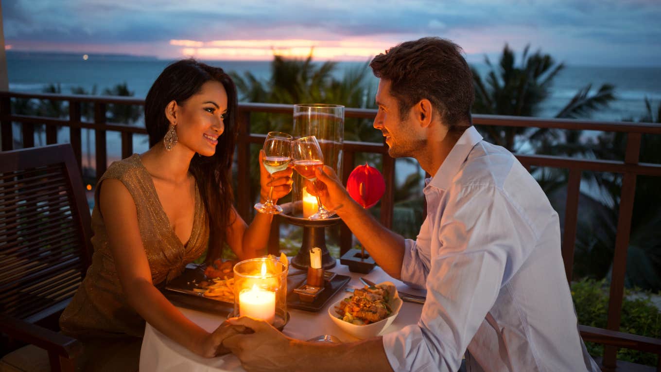 Woman Shares Her Favorite Tradition Her Boyfriend Started Every Time She Gets Her Period couple on a romantic candlelit date outside during sunset