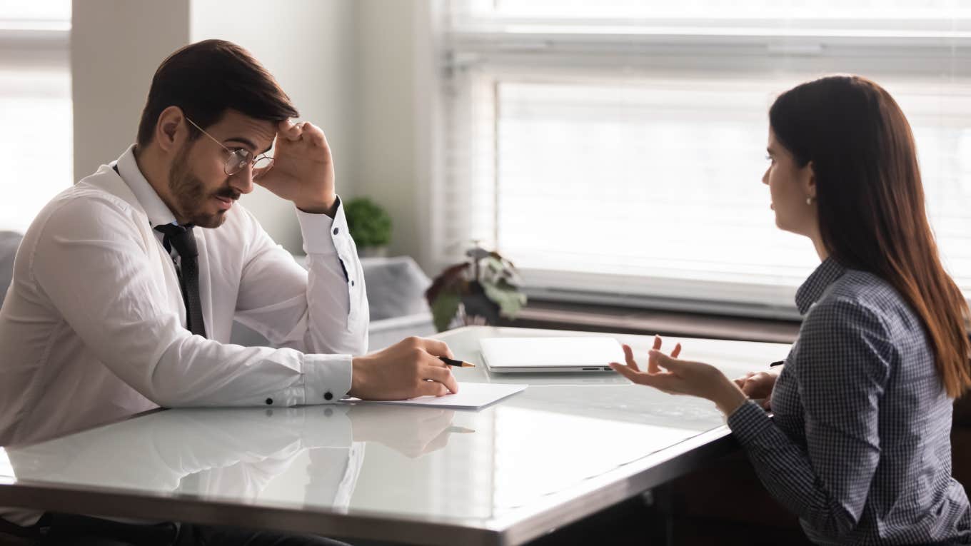 woman sitting in interview with manager in office