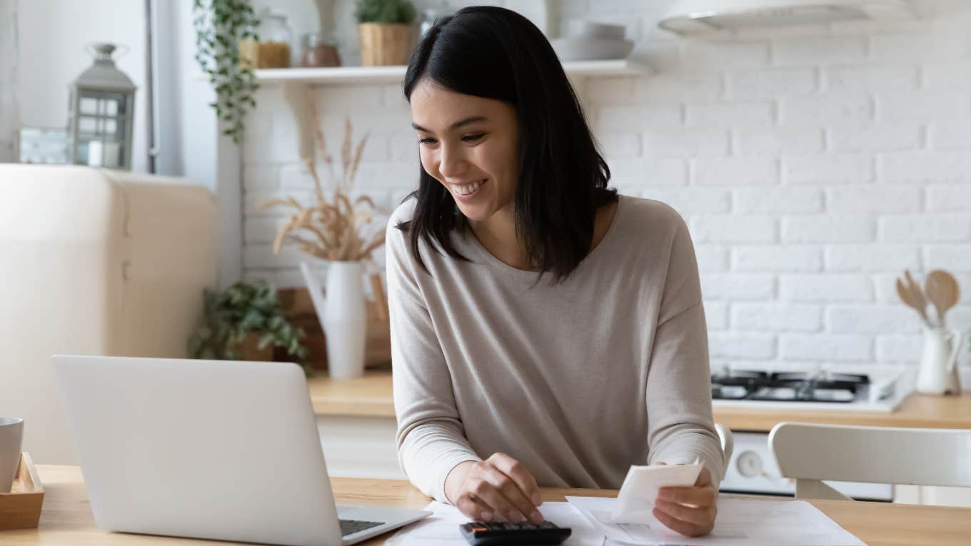 Worker Who Grew Up Poor Now Makes $18,000 A Month But Doesn’t Know What To Do With Their Money Woman working on finances