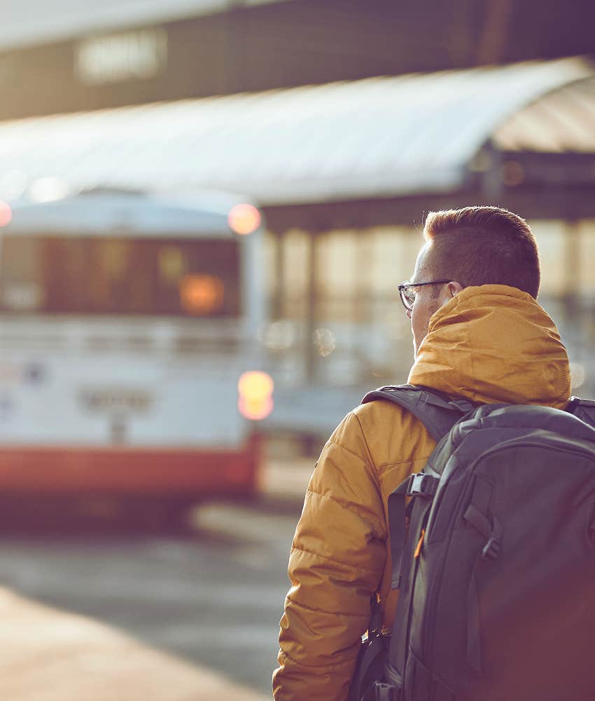 young man at bus stop