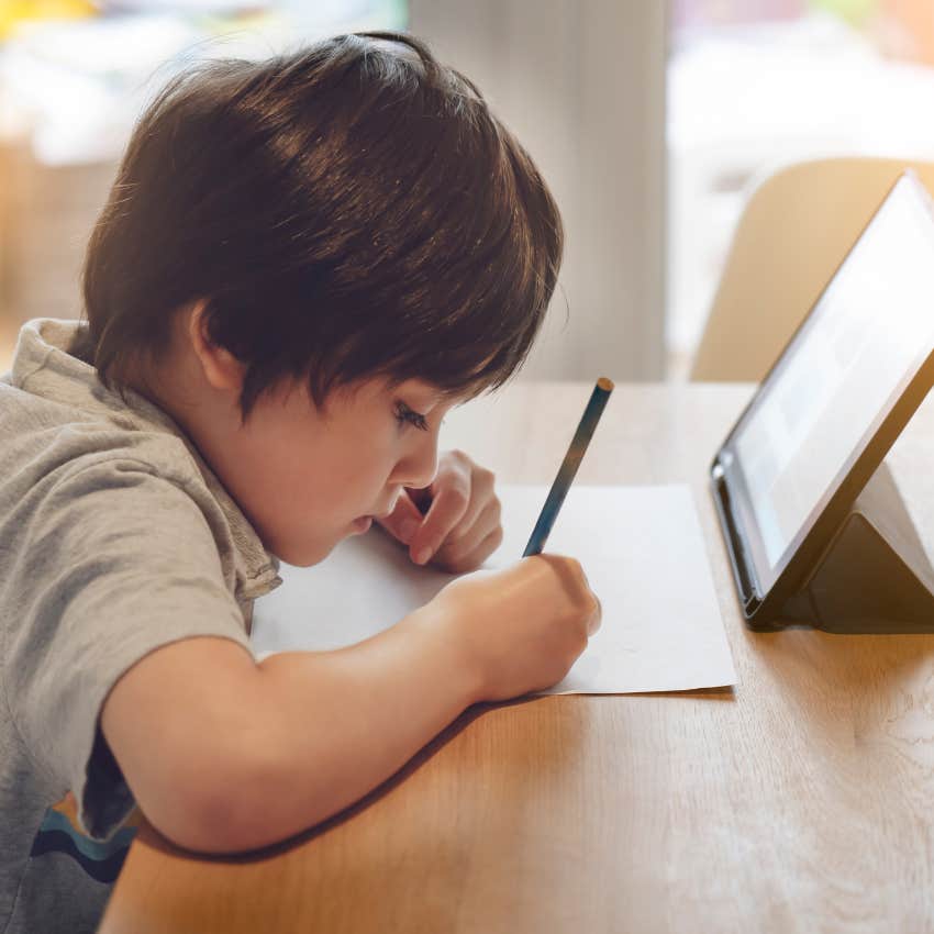 Underperforming student doing homework at a desk. 