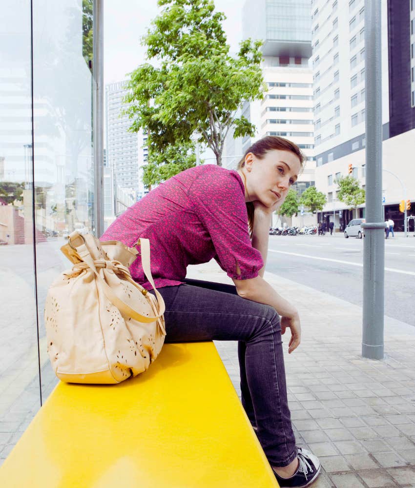 woman waiting at bus stop