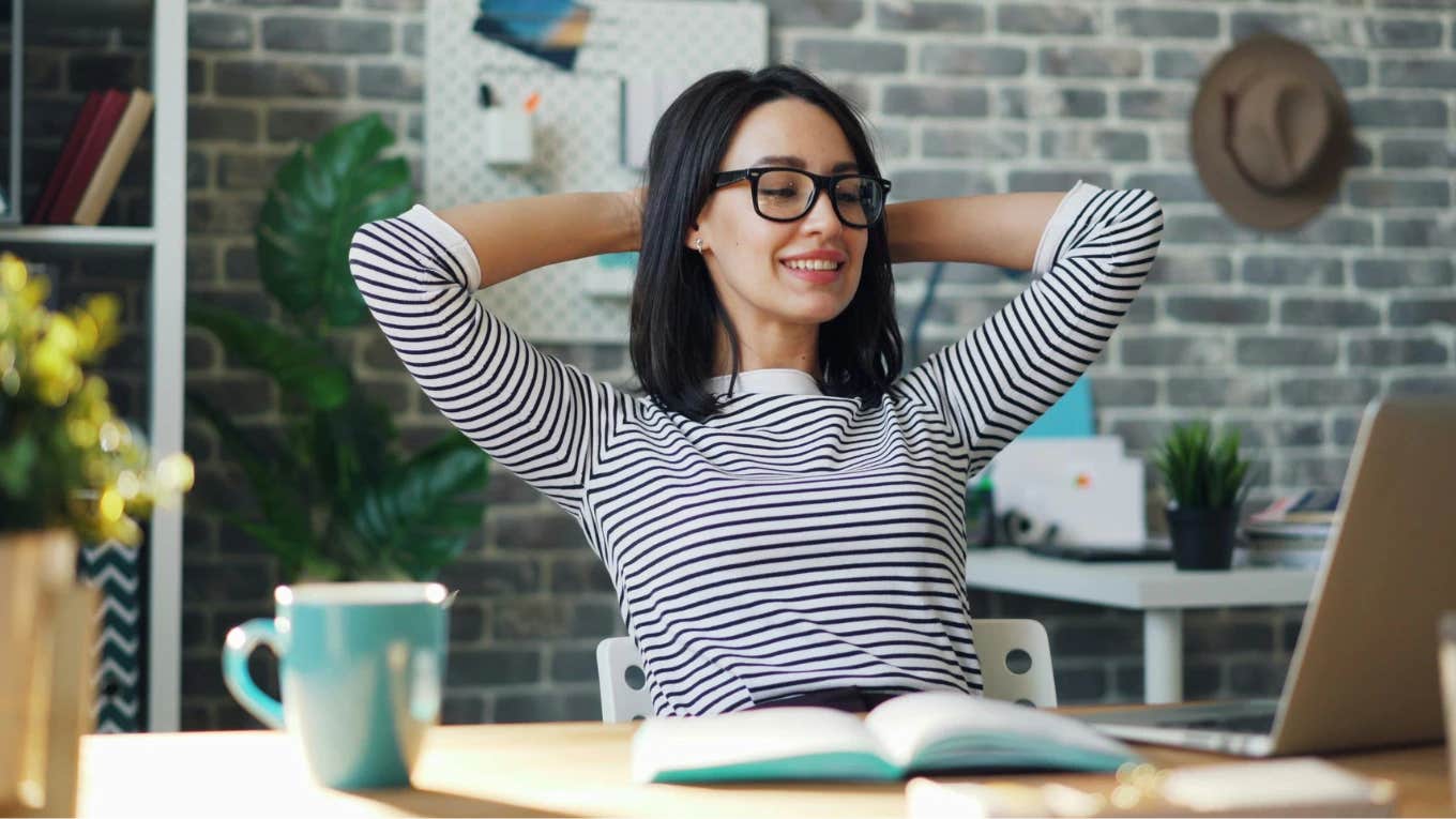 Career Expert Warns Workers To Walk Slow As Soon As You Start Any Job To Avoid Being Micromanaged woman relaxing at desk