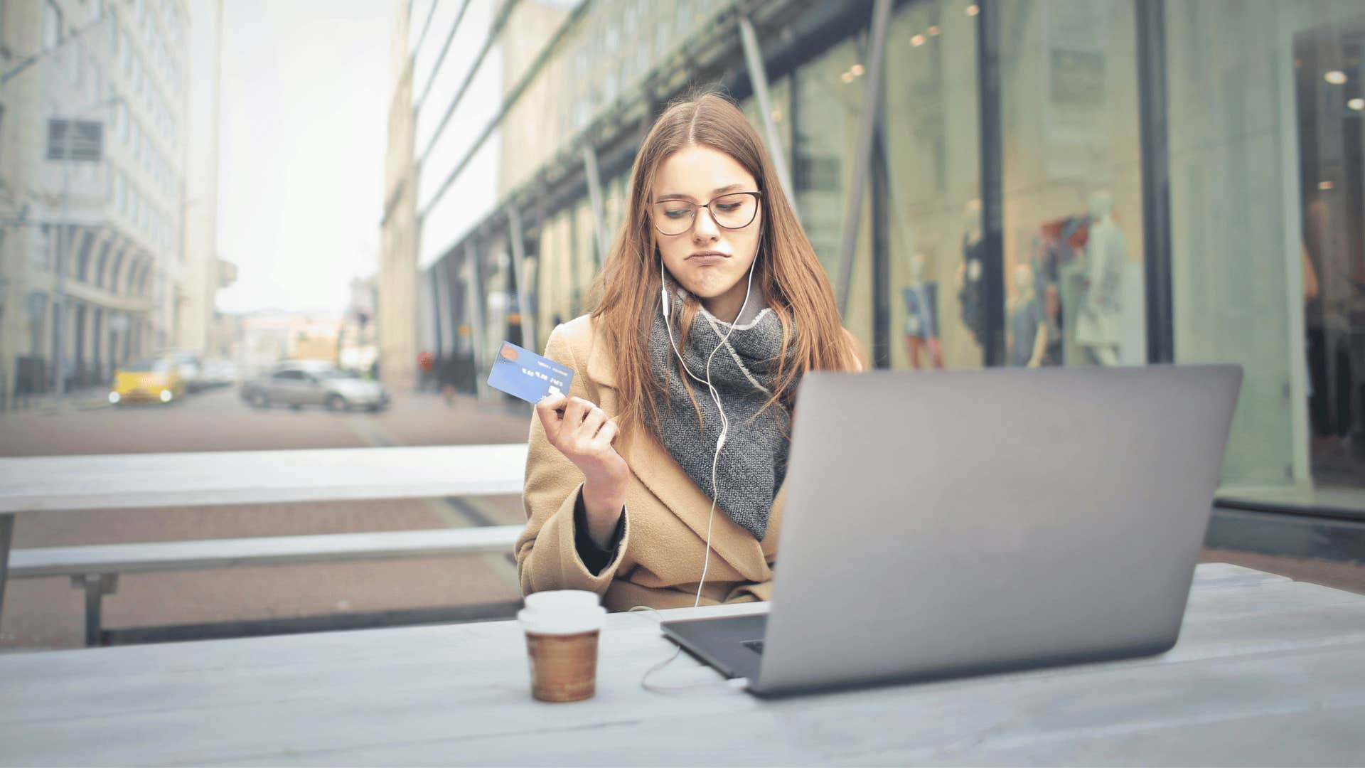 immature woman using credit card