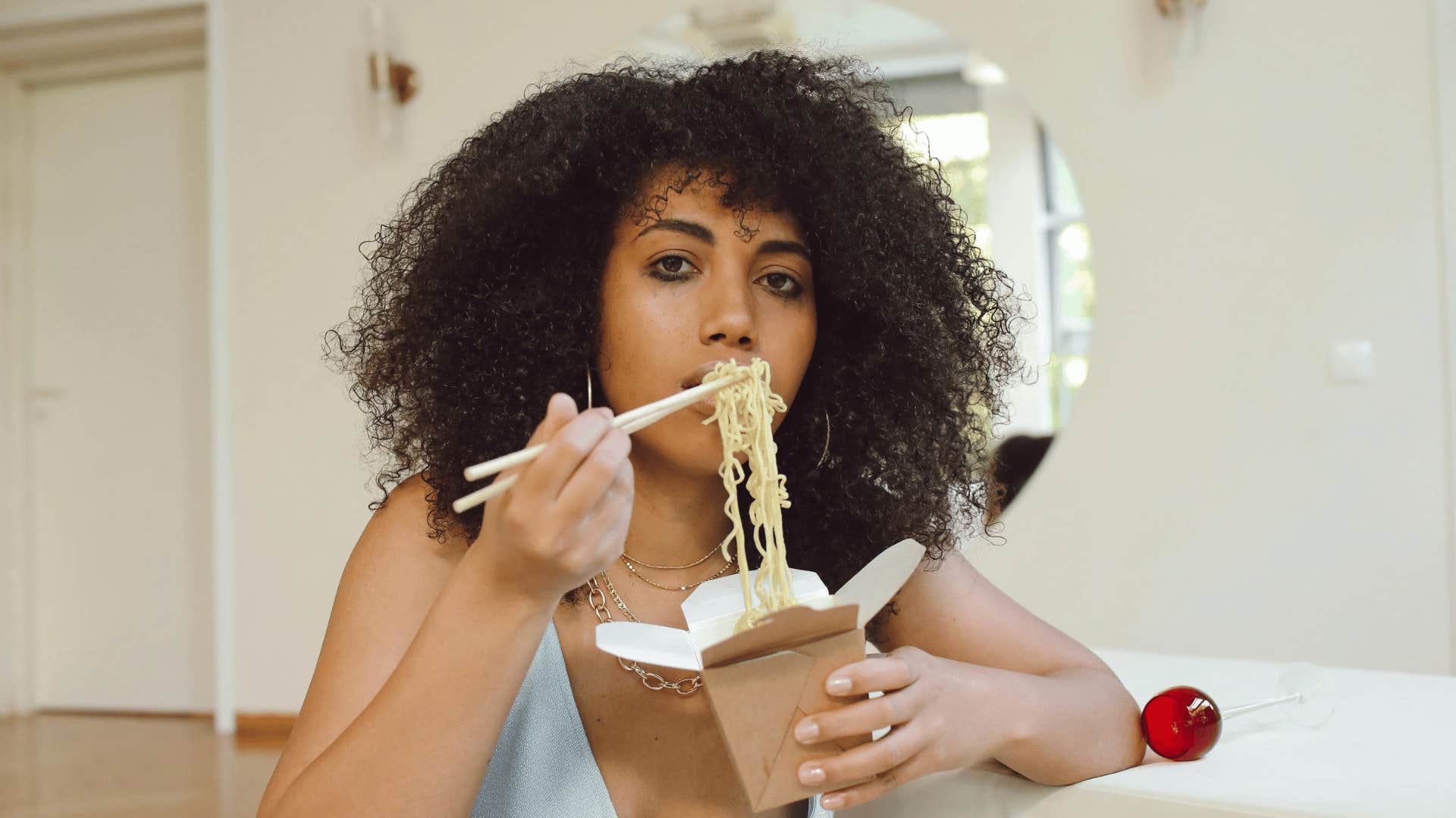 woman eating takeout food