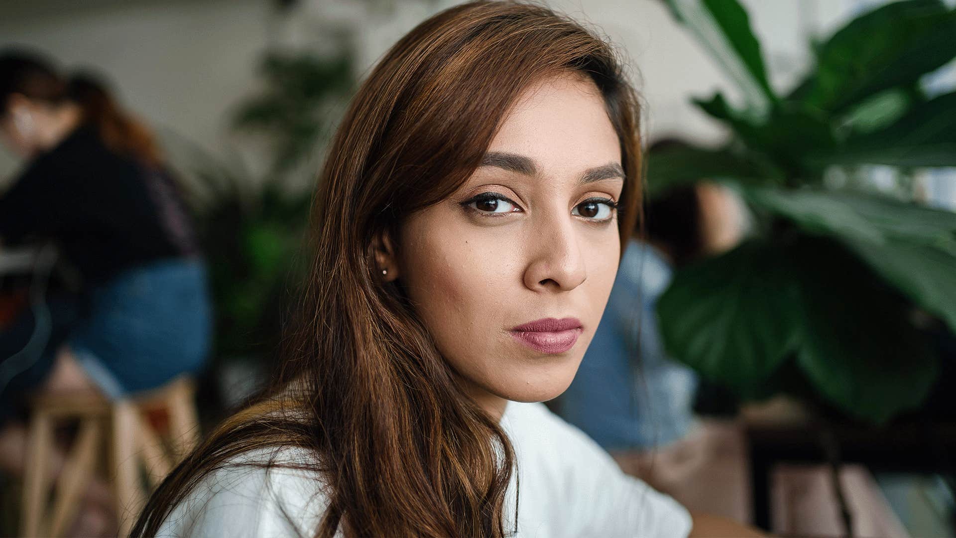 woman with brown hair looking at the camera