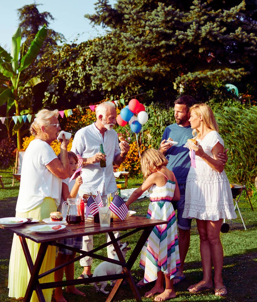 family celebrating 4th of July with an outdoor barbecue