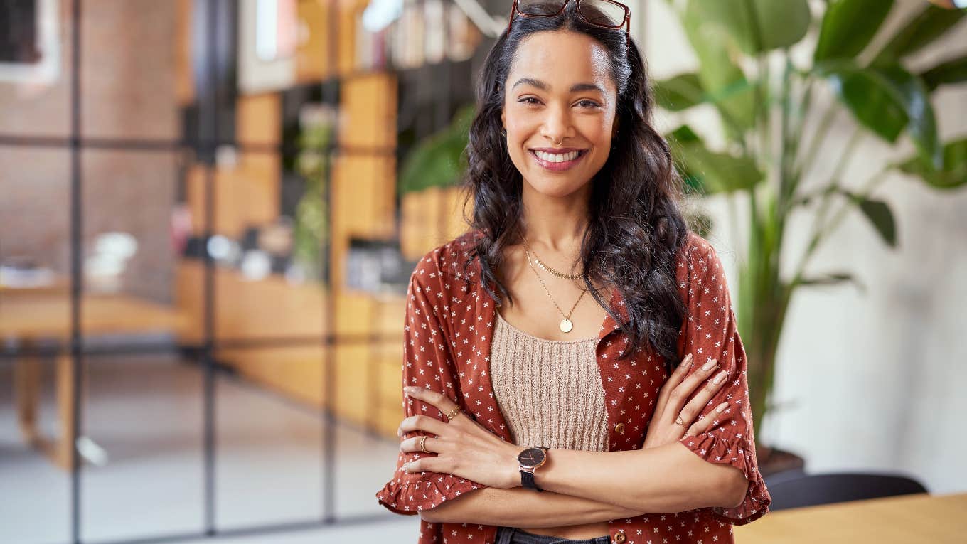 Why Your Insecurities Are Bad Habits And What You Can Do About Them woman crossing arms while smiling