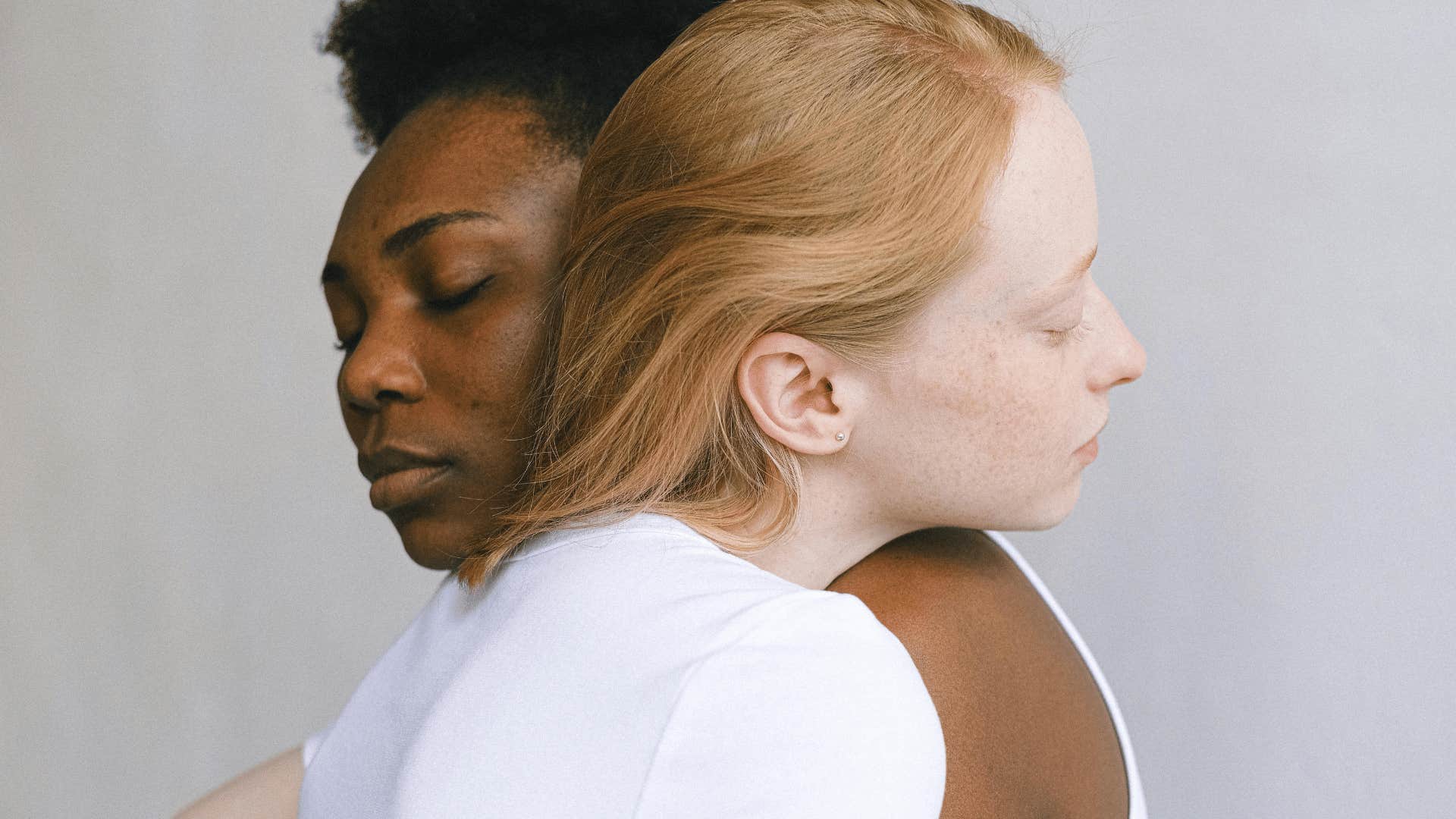 two friends hugging empathetically