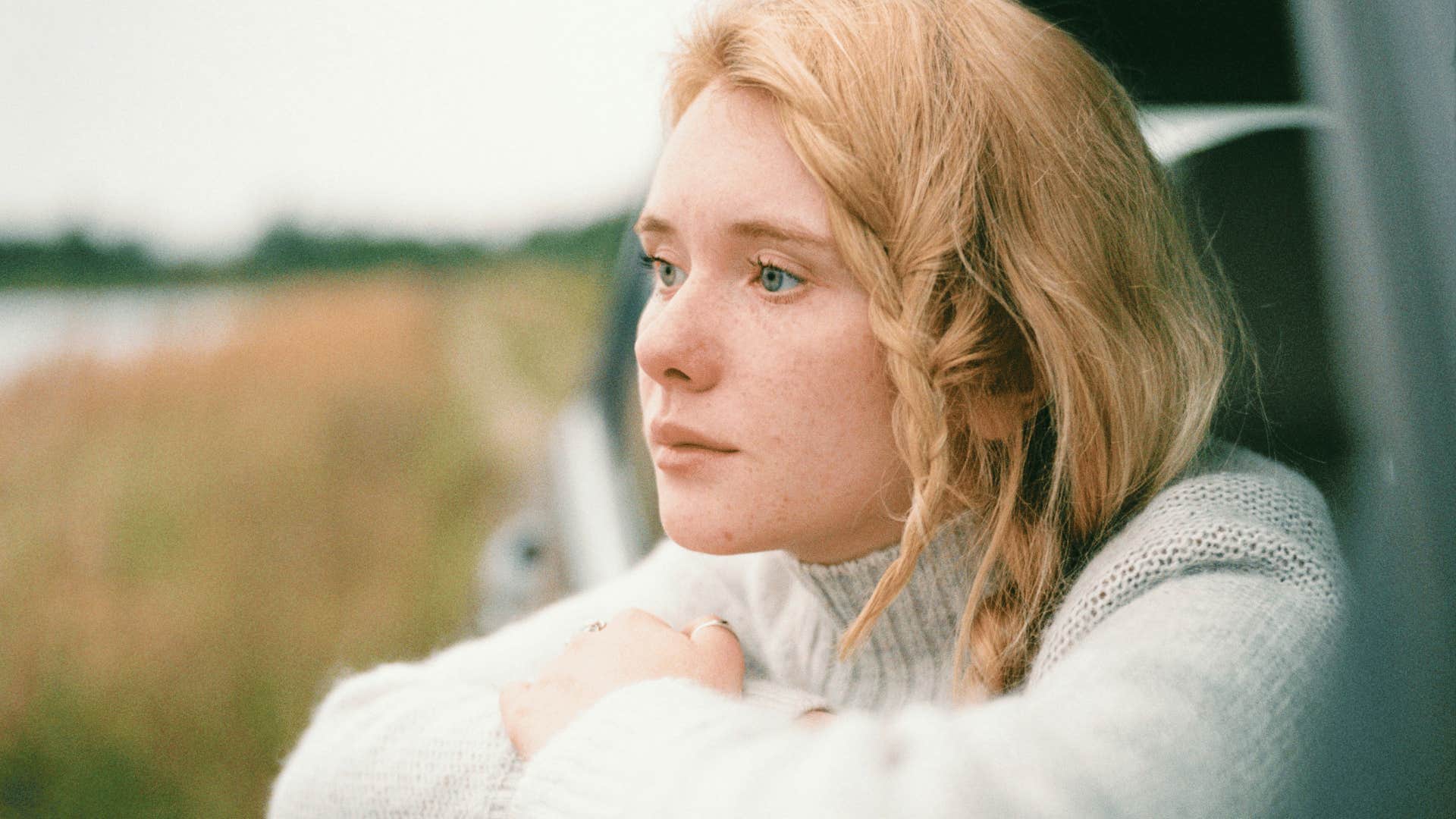 woman thinking out the car window
