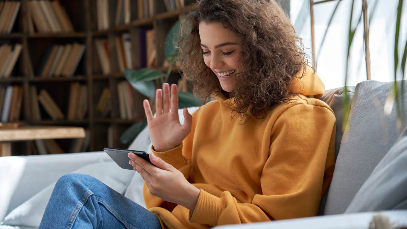Mom And Dad Demand To Go Through Their Children's Phones young woman sitting on the couch using her phone