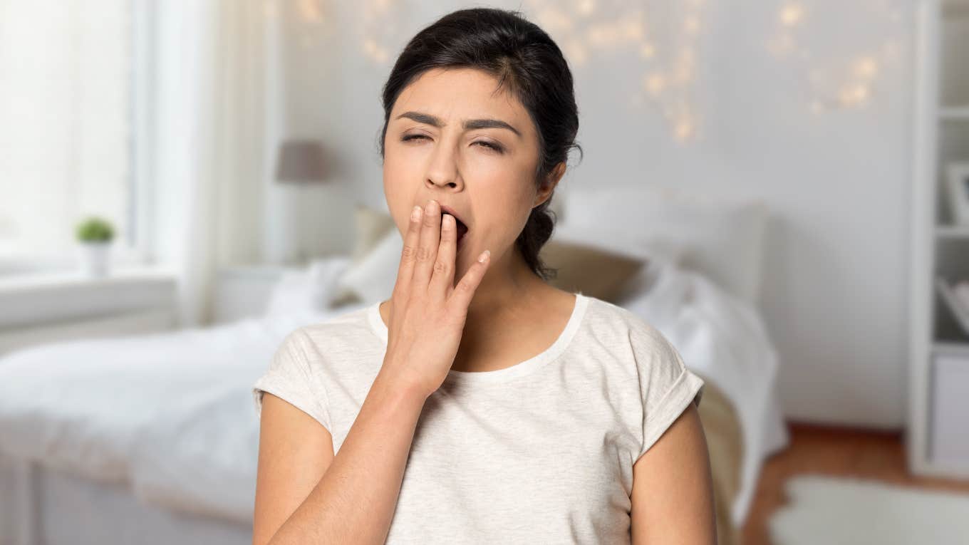 Mom Wakes Up Daughter Who ‘Overslept’ After Working Night Shift Teenage daughter looking tired after working night shift.