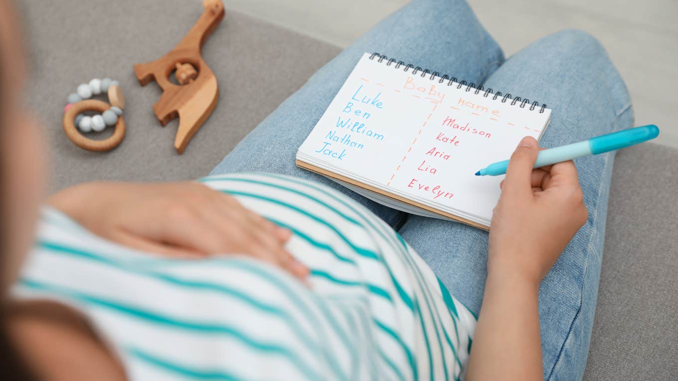 Mom Wonders If Her Son's Names Are Too Similar pregnant woman sitting on couch making list of baby names