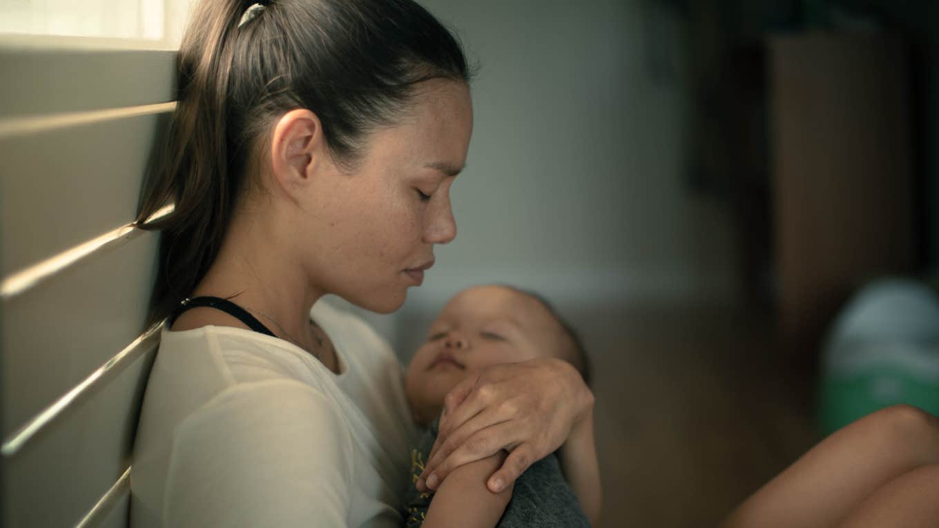 New Mom Feels Guilty After Her Husband Accuses Her Of Being A Bad Mom sad exhausted mother home alone with her baby