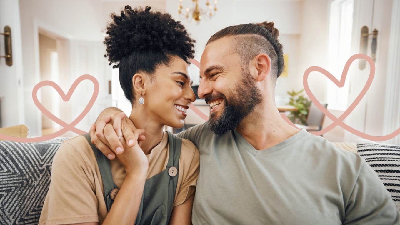 couple looking in to each others eyes with hearts