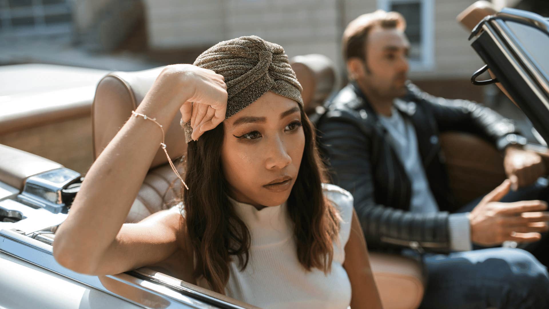 disappointed woman in car with man