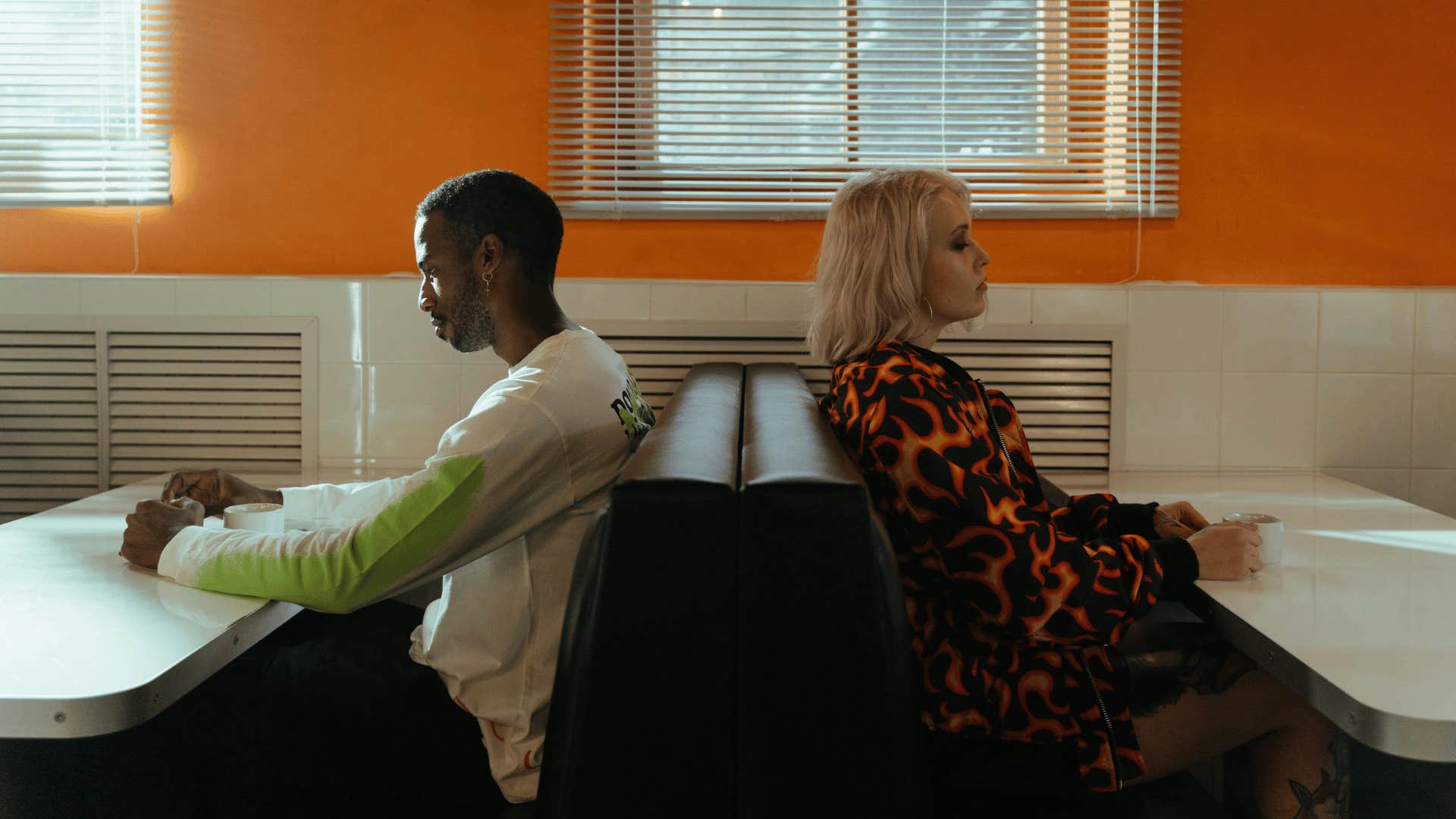 sad man and woman at diner