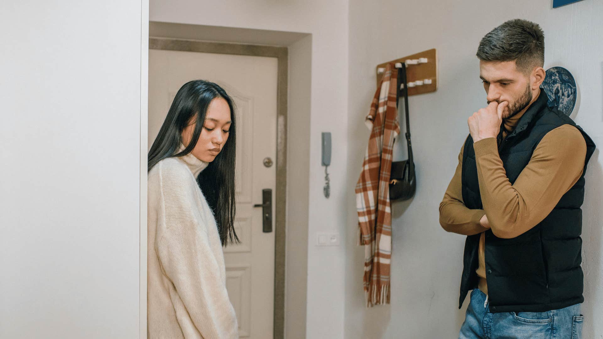 sad woman and sad man in apartment