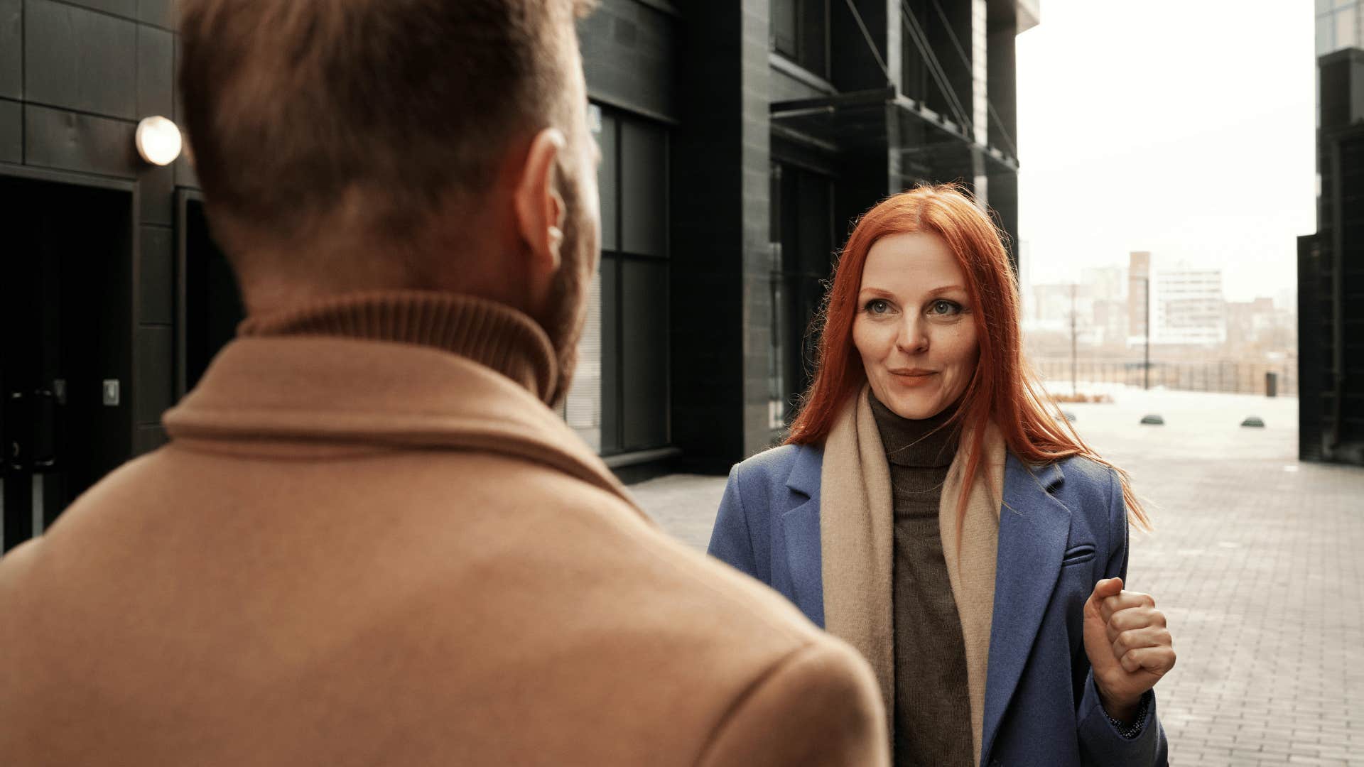 confident woman talking to man