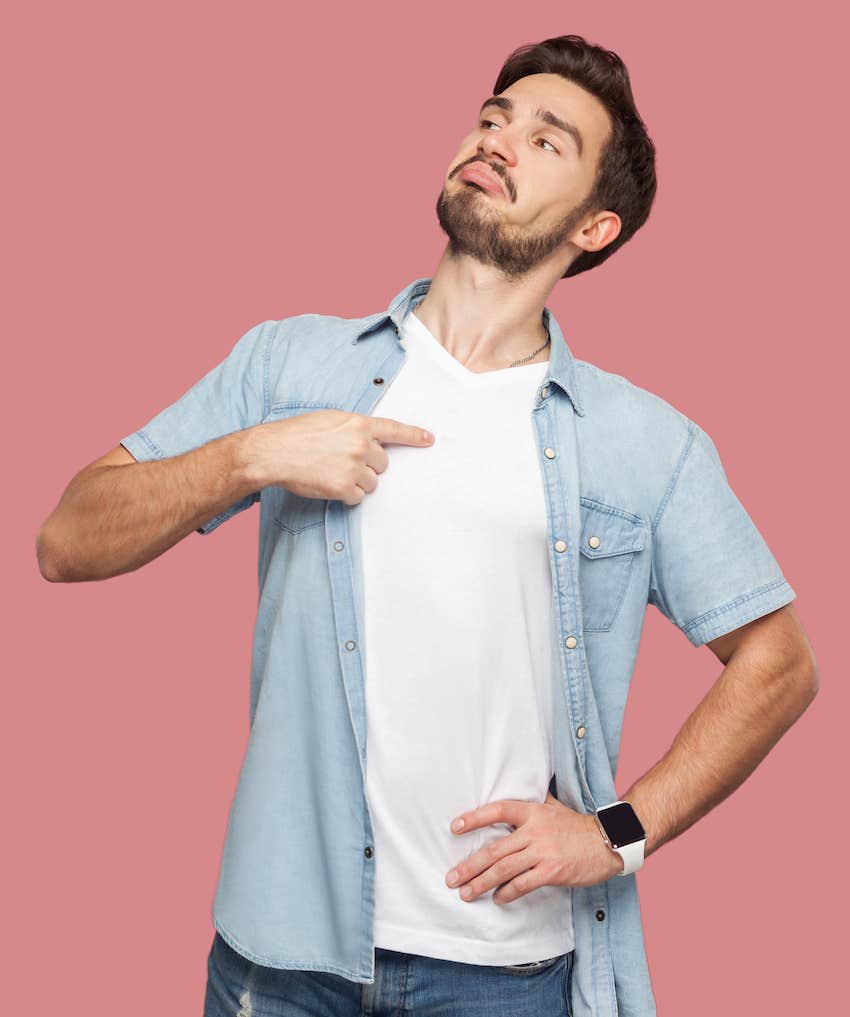 Selfish guy points at himself smugly