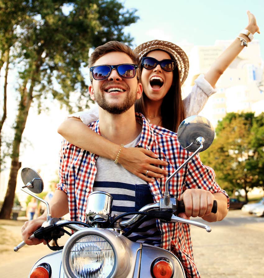 Couple on motorbike have fun on date night