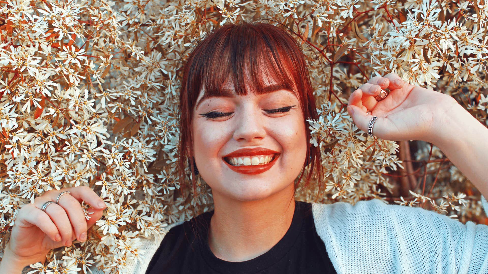 happy woman living her best life in the flowers