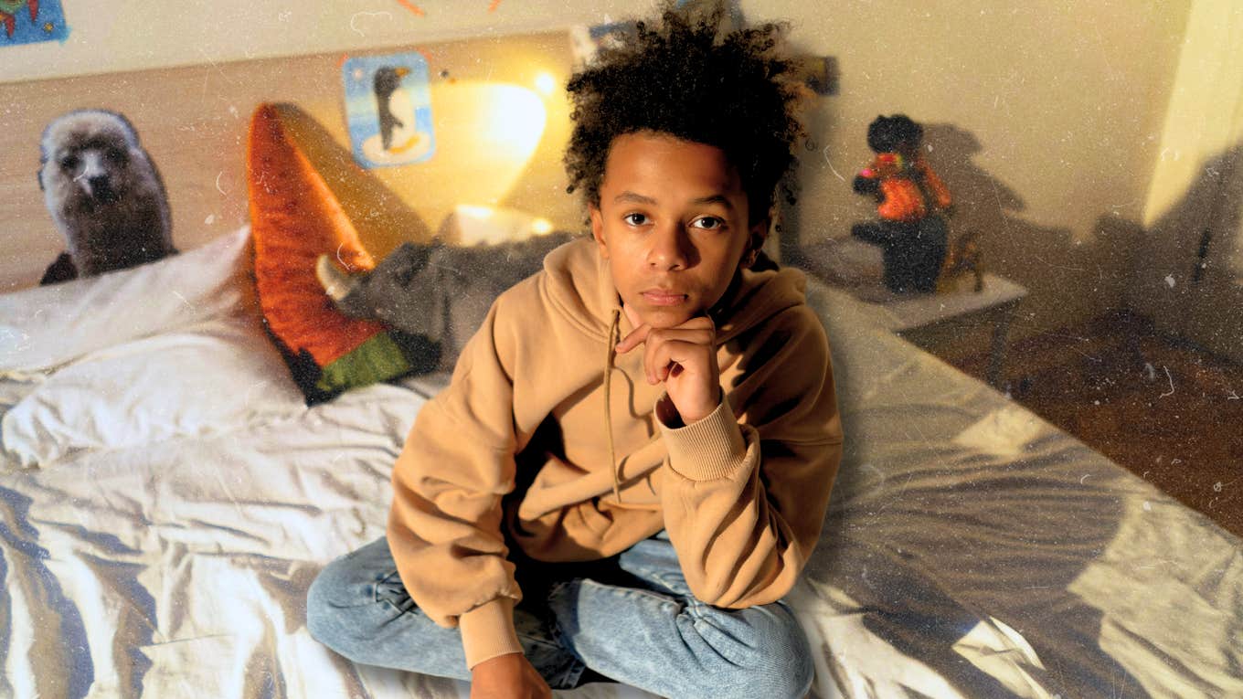 Depressed teenager sitting in bed