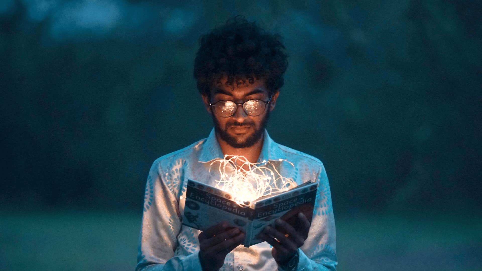 man committed to learning reading a book