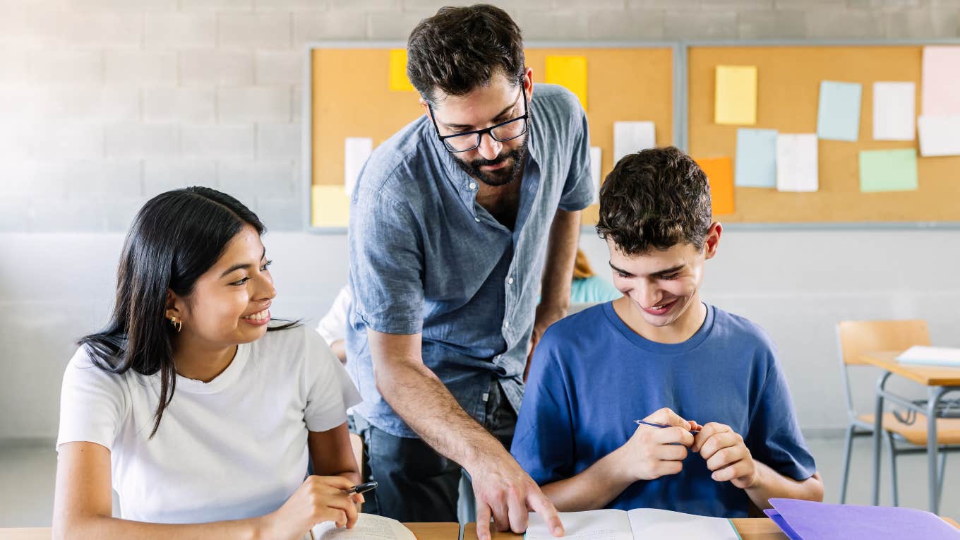 Teacher's Wife Upset He Doesn't Make More Money teacher helping high school students with their class work