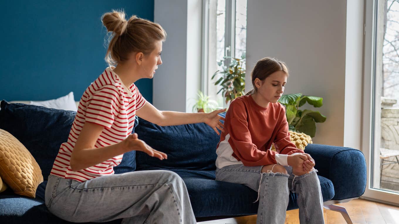 Teenager Demands Her Parents Let Her Change Her Name So People Stop Making Fun Of Her mother trying to speak with upset teen daughter while sitting together on sofa at home
