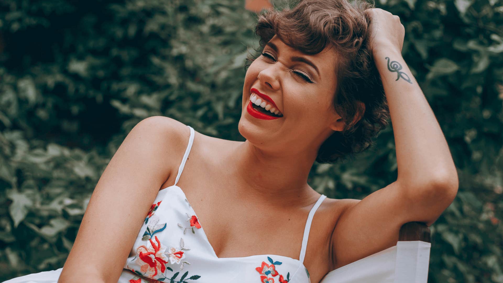 woman laughing to herself