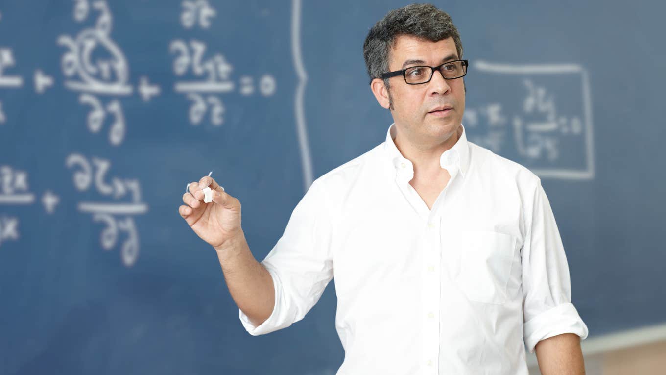 UCLA Physics Professor Is Told To Get A Second Job After Asking For A Raise Physics professor teaching in front of chalkboard.