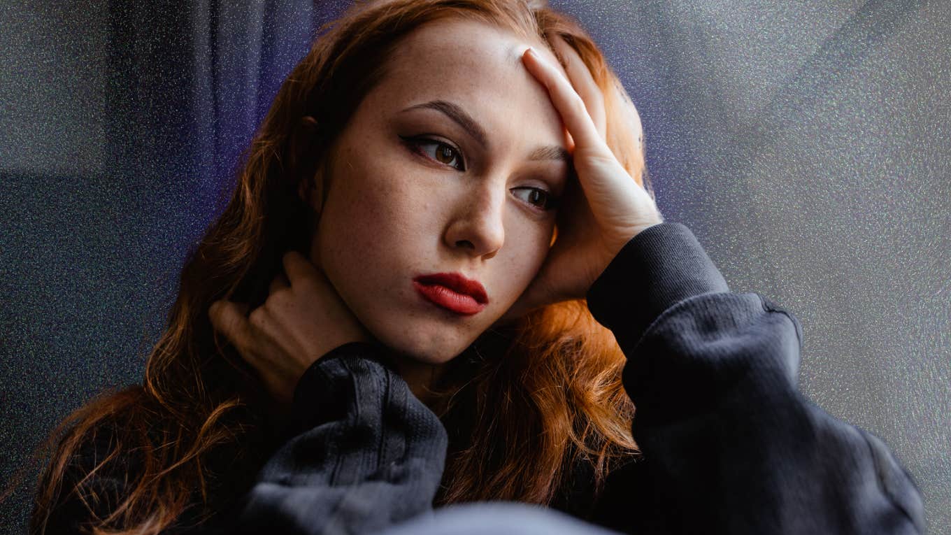 Woman contemplates the warning signs she is in a seriously abusive relationship.