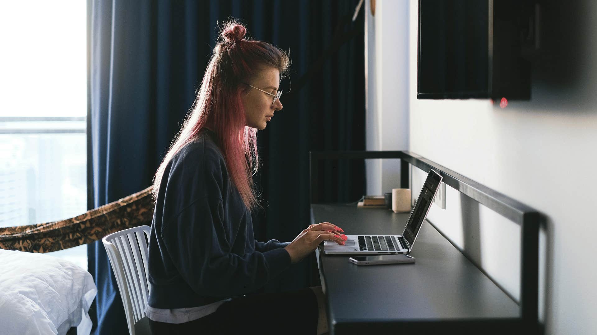 productive woman removing distractions to focus