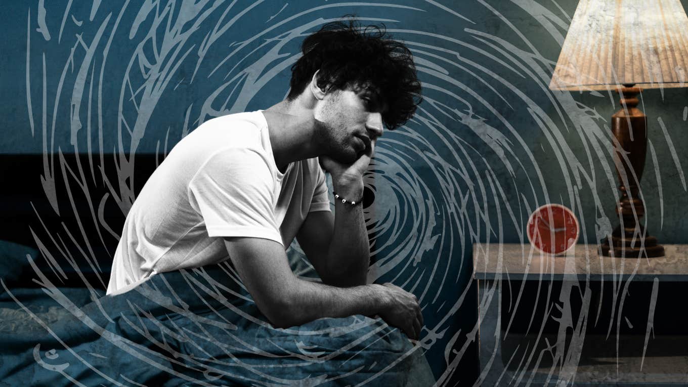 Ways That Anxiety Shows Up In Men Anxious man lying awake with insomnia